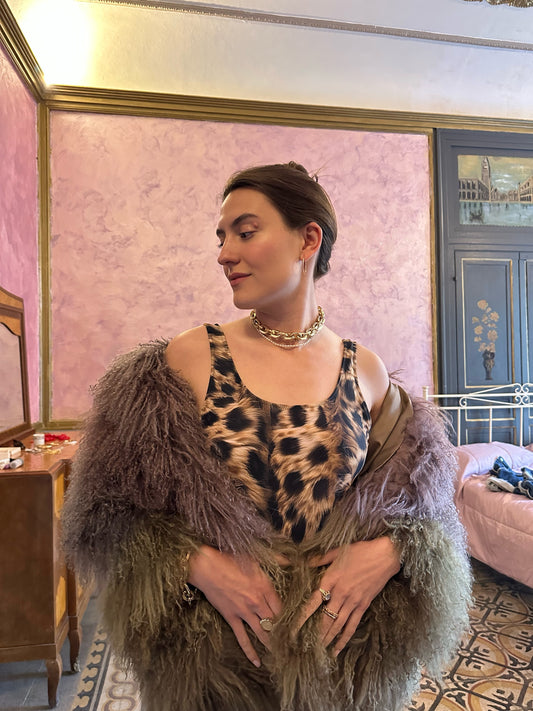 Woman wearing seamless cheetah one piece swimsuit