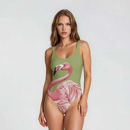 Woman wearing a green swimsuit with a flamingo design on a white background