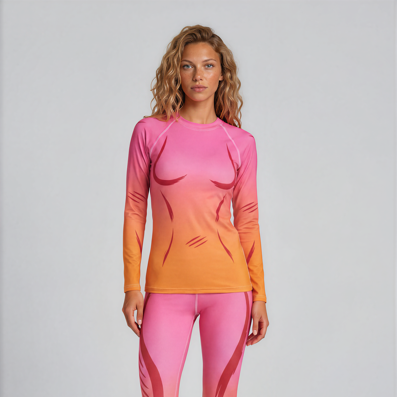 Woman wearing a pink and orange long-sleeve top and leggings on a white background